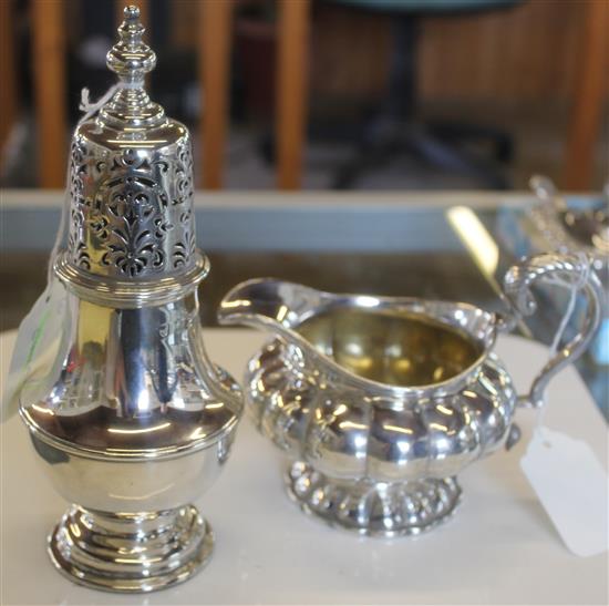 Silver sugar caster, weighted & a silver cream jug of compressed lobed form (all marks rubbed)
